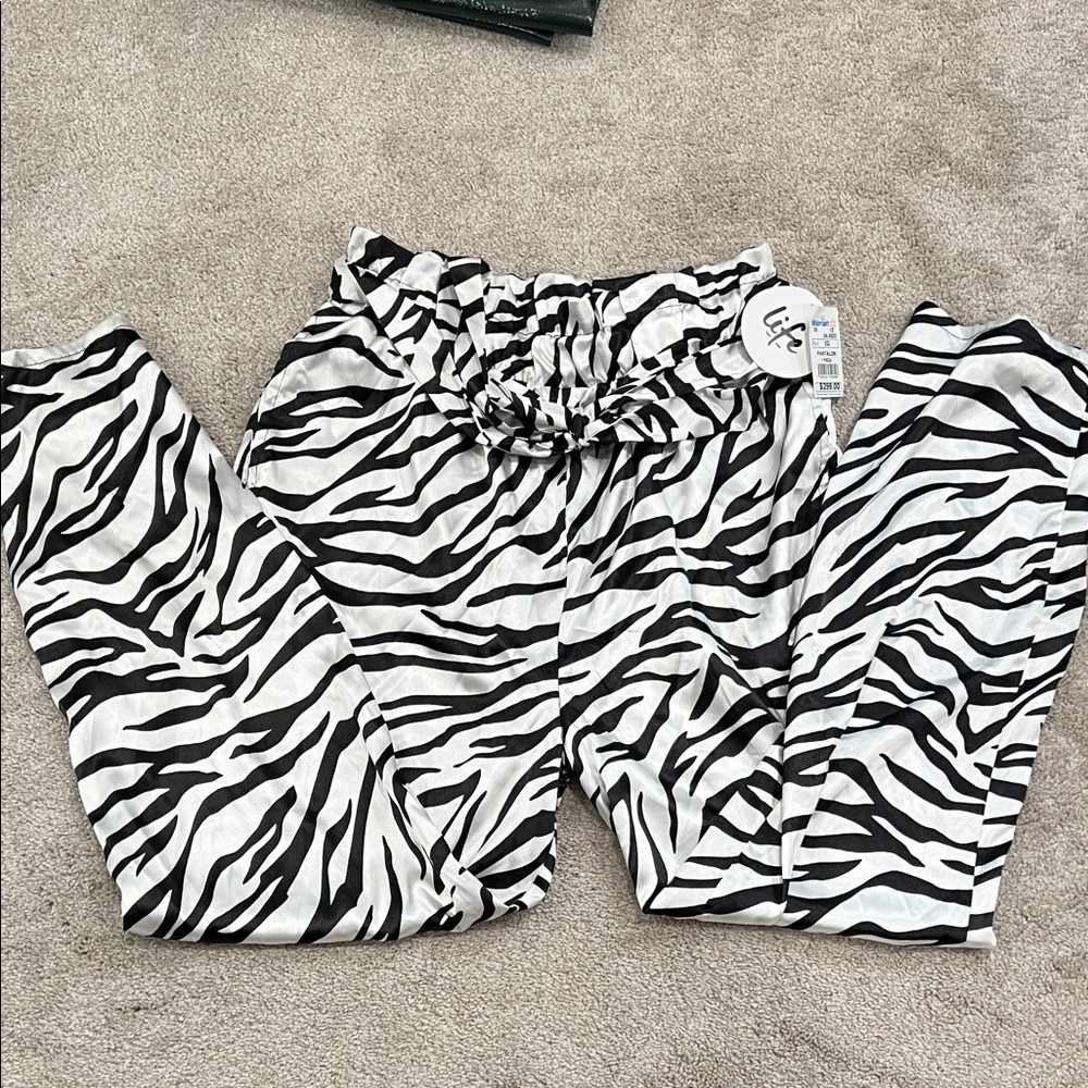 Brand new w/tags. Zebra satin pants. Size XL